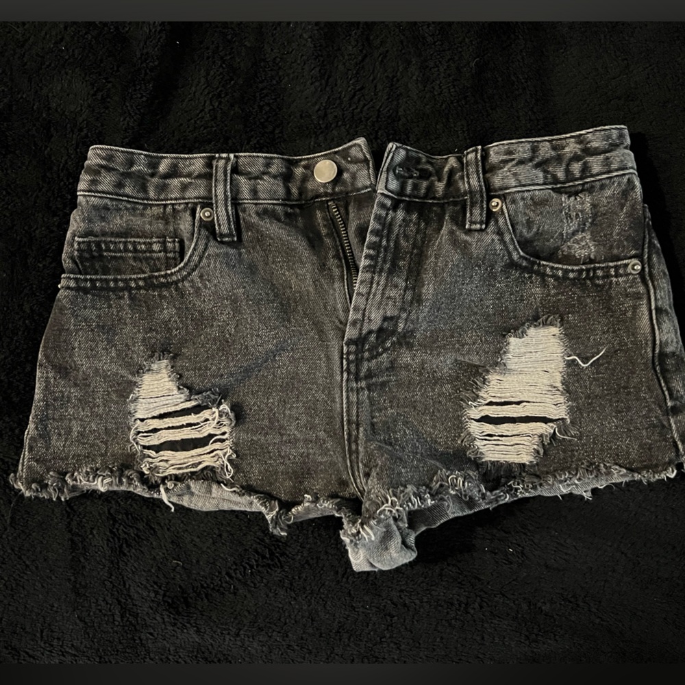 Size 25, Forever 21 black ripped shorts.